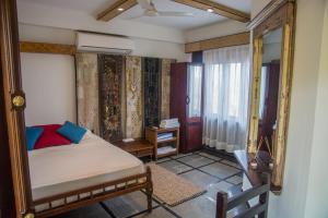 Postel nebo postele na pokoji v ubytování 36 Palms Boutique Retreat + 37 fotografií