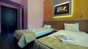 Postel nebo postele na pokoji v ubytování Hotel Alabin Central