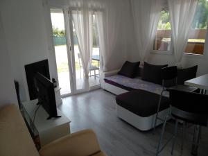 TV a/nebo společenská místnost v ubytování Villa Katia