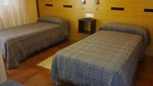 Posteľ alebo postele v izbe v ubytovaní Hostal-Meson Vilasante