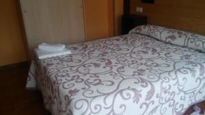Posteľ alebo postele v izbe v ubytovaní Hostal-Meson Vilasante