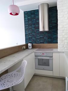 Kuchyňa alebo kuchynka v ubytovaní Sea Cliff Apartment Rewal