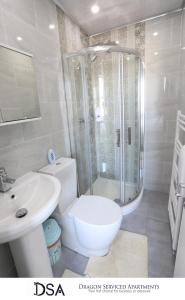 a bathroom with a shower and a toilet and a sink at Birmingham Central Apartment (Studio 4) in Birmingham