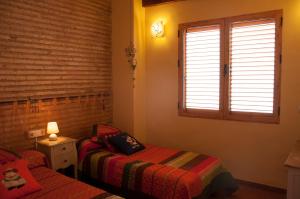 Posteľ alebo postele v izbe v ubytovaní Homely Nest Valencia El Carme