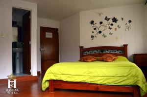 Postel nebo postele na pokoji v ubytování Hotel Dancar