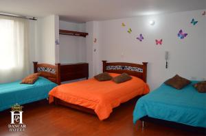 Postel nebo postele na pokoji v ubytování Hotel Dancar