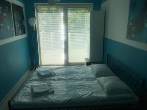 Katil atau katil-katil dalam bilik di Playa Baltis Sunny Apartment