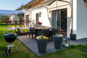 Zahrada ubytování ApartDomek7b Jasne Wybrzeże - nowy i luksusowy