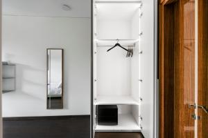 a room with a mirror and a closet at The Joseph in Vilnius