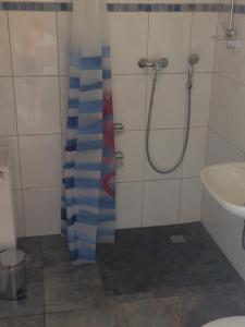 Koupelna v ubytování „Lüttje Nüst“ + 11 fotografií