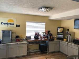 a kitchen with a large counter top with at Days Inn by Wyndham Bradenton I-75 in Bradenton