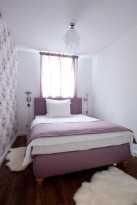 Ein Bett oder Betten in einem Zimmer der Unterkunft Ellena`s FEWO am Uke