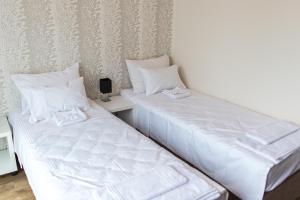 Llit o llits en una habitació de Zam Residence