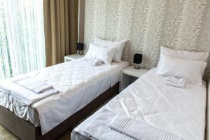 Llit o llits en una habitació de Zam Residence