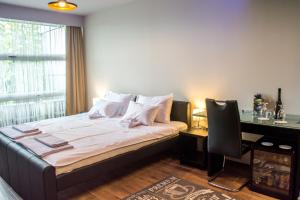 Llit o llits en una habitació de Zam Residence