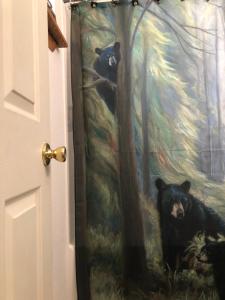 a painting of two black bears in a forest at Peaceful Talkeetna Getaway #1 in Talkeetna