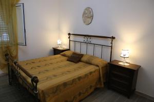 Postel nebo postele na pokoji v ubytování L'Aurora Tropea