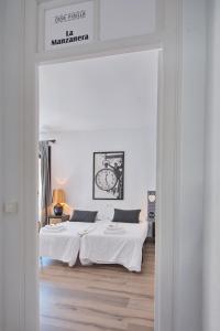 Säng eller sängar i ett rum på Pension Casa Pinilla