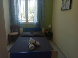 A bed or beds in a room at Monte Caputo Holiday House