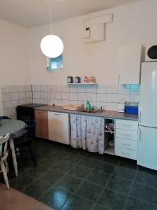Kuchyň nebo kuchyňský kout v ubytování Blue Holidays Apartment