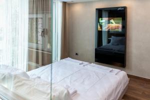 Llit o llits en una habitació de Zam Residence