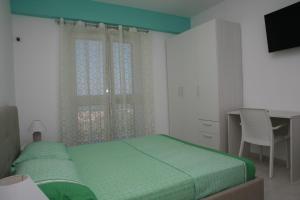 Posteľ alebo postele v izbe v ubytovaní B&B Torre Nave