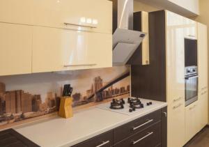 a kitchen with white cabinets and a stove top oven at Апартаменты в центре на Ришельевской in Odesa +7 photos