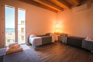 Ένα ή περισσότερα κρεβάτια σε δωμάτιο στο B&B Da Peppa