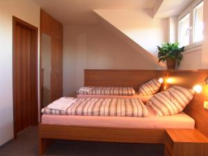 Een bed of bedden in een kamer bij Penzion Ruland