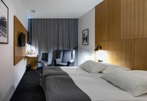 Postel nebo postele na pokoji v ubytování Hotel Olimp Business & Spa