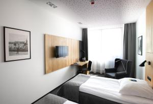 TV a/nebo společenská místnost v ubytování Hotel Olimp Business & Spa