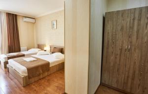 Voodi või voodid majutusasutuse Hotel Old Borjomi toas