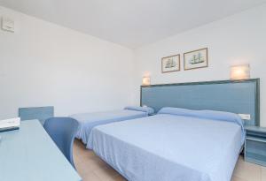 Postel nebo postele na pokoji v ubytování Hotel Platja d'Aro