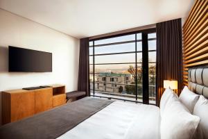 a hotel room with a bed and a large window at Metropolitan Hotels Bosphorus - Special Category in Istanbul