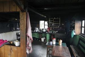a small kitchen with a table in a room at Borong Polok Village Homestay in Ravangla
