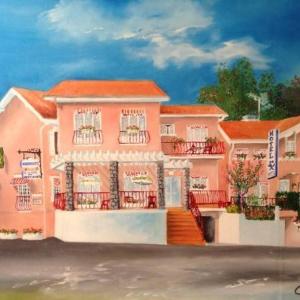 a painting of a pink apartment building with a staircase at Maison Jean le Bon in Dax