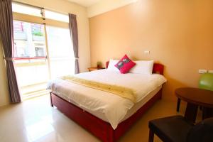 Postelja oz. postelje v sobi nastanitve Yilan B&B - Happy Snail