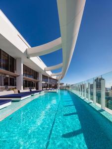 a swimming pool on the roof of a building at The Darling at The Star Gold Coast in Gold Coast