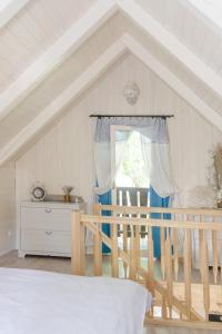 a bedroom with a bed and a window at Chata Monika in Hrubá Skála