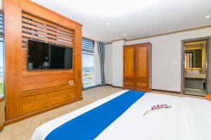 Postel nebo postele na pokoji v ubytování Navy Hotel Cam Ranh