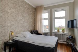 Letto o letti in una camera di Grand Hotel Jonkoping, BW Signature Collection