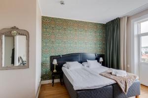 Säng eller sängar i ett rum på Grand Hotel Jönköping