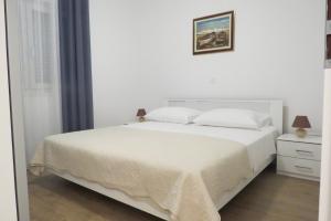 Postel nebo postele na pokoji v ubytování Grey House Zadar