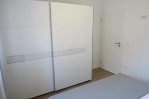 Postel nebo postele na pokoji v ubytování Grey House Zadar