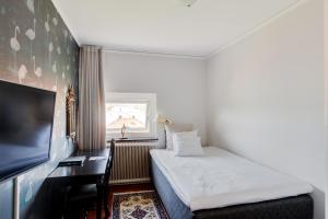Letto o letti in una camera di Grand Hotel Jonkoping, BW Signature Collection