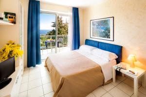 מיטה או מיטות בחדר ב-Residence Modus Vivendi