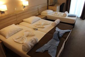 Vile Oliva Hotel & Resort客房内的一张或多张床位