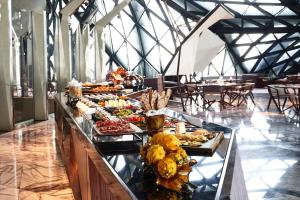 a buffet table with many different types of food at City of Dreams - Morpheus in Macau