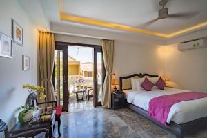 Voodi või voodid majutusasutuse Hoian Central Hotel toas