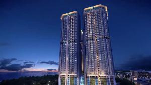 a tall building with lights on it at night at Atlantis Residence B19 5-6 pax l 5 mins Jonker St by Lullaby Retreats in Melaka